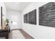 Chic entryway featuring modern wall art, wood flooring, and a view of the front door at 608 Belshire Dr, Acworth, GA 30102