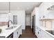 Bright modern kitchen features stainless steel appliances and a spacious island with quartz countertops at 608 Belshire Dr, Acworth, GA 30102