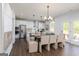 Open-concept kitchen featuring an island, stainless steel appliances, and an adjacent dining area at 608 Belshire Dr, Acworth, GA 30102