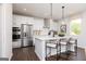 Kitchen features stainless steel appliances, a kitchen island with seating, and pendant lights at 608 Belshire Dr, Acworth, GA 30102
