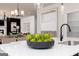 Modern kitchen island features a black faucet and sink, complemented by stylish artichoke decorations at 608 Belshire Dr, Acworth, GA 30102