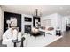 Chic living room with black accent wall, fireplace, modern lighting, and comfortable seating at 608 Belshire Dr, Acworth, GA 30102