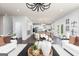 Open-concept living room with modern lighting, views into the kitchen, and hardwood flooring at 608 Belshire Dr, Acworth, GA 30102