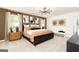 Spacious main bedroom features a decorative chandelier, natural light, and neutral colored decor with matching furnishings at 608 Belshire Dr, Acworth, GA 30102