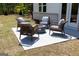 Inviting patio area with stylish seating around a fire pit, ideal for enjoying warm evenings outdoors at 608 Belshire Dr, Acworth, GA 30102