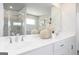 Bright bathroom with white countertops, double sinks, and a large decorative mirror at 502 Regency Trl, Acworth, GA 30102