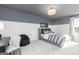 Cozy bedroom featuring plush carpet, two-tone walls, and a desk for optimal study or game time at 502 Regency Trl, Acworth, GA 30102