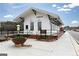 White building in a charming depot setting with black accents and outdoor flower planters at 502 Regency Trl, Acworth, GA 30102