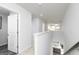 Upstairs hallway with carpet flooring leading to the kitchen area at 502 Regency Trl, Acworth, GA 30102