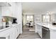 Open kitchen concept with an island, stainless steel appliances, and view of adjacent dining and living areas at 502 Regency Trl, Acworth, GA 30102