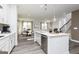 Open kitchen design featuring a central island, stainless steel appliances, and a view of the dining area at 502 Regency Trl, Acworth, GA 30102