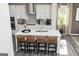 Modern kitchen with white cabinets, stainless steel appliances, and a large island with seating at 502 Regency Trl, Acworth, GA 30102