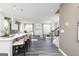 Open-concept living space featuring modern gray flooring, a kitchen island and an adjoining living room at 502 Regency Trl, Acworth, GA 30102