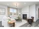Comfortable living room with fireplace, large windows, and stylish decor at 502 Regency Trl, Acworth, GA 30102