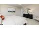 Bright bedroom featuring a white comforter, dark wood furniture, and neutral carpet at 502 Regency Trl, Acworth, GA 30102