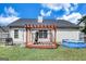 The backyard has a wooden pergola, a blue portable pool, a white fence, and a gas grill at 11367 Vinea Ln, Hampton, GA 30228