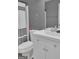 Compact bathroom featuring a black and white shower curtain, modern vanity, and gray walls at 11367 Vinea Ln, Hampton, GA 30228