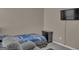 Comfortable bedroom with a cozy recliner, a plush bed, and soft, neutral colors for a relaxing atmosphere at 11367 Vinea Ln, Hampton, GA 30228