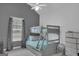 Shared bedroom with a bunk bed, a storage dresser, and a spacious design at 11367 Vinea Ln, Hampton, GA 30228