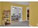 Bright bonus room with a view of the dining room and kitchen at 11367 Vinea Ln, Hampton, GA 30228