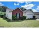 A charming home showcasing a combination of brick and vinyl siding, complemented by a well-maintained lawn at 11367 Vinea Ln, Hampton, GA 30228