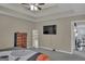 Comfortable main bedroom with a TV, a mirror, and a view to the living room at 11367 Vinea Ln, Hampton, GA 30228