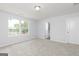 Bright bedroom with plush carpet, double windows offering natural light, and an en-suite bathroom at 407 Newland Way, Acworth, GA 30102
