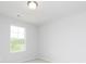 Bright bedroom features a window with scenic outdoor views and neutral carpet at 407 Newland Way, Acworth, GA 30102