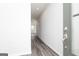 Bright entryway with durable wood-look flooring, white walls, and a view into the home at 407 Newland Way, Acworth, GA 30102