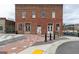 Two-story brick building featuring multiple windows, doors, and sidewalk at 407 Newland Way, Acworth, GA 30102