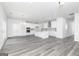 Open concept kitchen with white cabinets, stainless appliances and large island at 407 Newland Way, Acworth, GA 30102