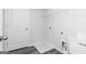 Functional laundry room with utility sink, washer and dryer hookups, and storage space at 407 Newland Way, Acworth, GA 30102