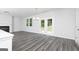 Bright living room with fireplace and access to backyard through glass panel doors at 407 Newland Way, Acworth, GA 30102