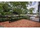 Outdoor deck with black railing overlooking private wooded backyard at 1772 Martin Se Pl, Smyrna, GA 30080