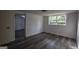 Basement with modern floors, white trim, and doorway to another room at 1772 Martin Se Pl, Smyrna, GA 30080