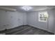 Bright basement space featuring modern flooring and natural light from the window at 1772 Martin Se Pl, Smyrna, GA 30080