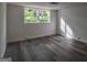 Finished basement with natural light and sleek, modern flooring at 1772 Martin Se Pl, Smyrna, GA 30080