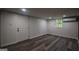 Finished basement with modern flooring, white walls, and convenient air conditioning unit at 1772 Martin Se Pl, Smyrna, GA 30080