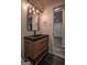 Updated bathroom vanity with black hardware and stylish lighting at 1772 Martin Se Pl, Smyrna, GA 30080