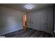 Neutral bedroom with two closets, an overhead light, and wood-look floors at 1772 Martin Se Pl, Smyrna, GA 30080