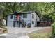Exterior view of the home featuring a deck and staircase at 1772 Martin Se Pl, Smyrna, GA 30080