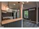 Open kitchen layout with stainless appliances, modern lighting, and breakfast bar area at 1772 Martin Se Pl, Smyrna, GA 30080