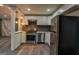 Kitchen with stainless steel appliances, stylish backsplash, and modern pendant lighting at 1772 Martin Se Pl, Smyrna, GA 30080