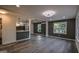 Spacious living room with wood floors, open to the kitchen with stylish finishes at 1772 Martin Se Pl, Smyrna, GA 30080