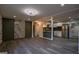 Open-concept living room with wood floors, accent walls, and kitchen view at 1772 Martin Se Pl, Smyrna, GA 30080