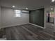 Spacious room with wood-look floors, mini-split system and a view to other rooms at 1772 Martin Se Pl, Smyrna, GA 30080