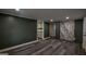 Open-concept room featuring wood-look flooring and a decorative accent wall at 1772 Martin Se Pl, Smyrna, GA 30080