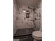 Stylish shower with black and white tile and a unique shower caddy at 1772 Martin Se Pl, Smyrna, GA 30080