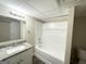 Bathroom featuring a shower-tub, a granite vanity and neutral colors at 2860 Lynda Pl, Decatur, GA 30032