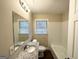 Bright bathroom featuring a granite vanity, and a bathtub with white tile surround at 2860 Lynda Pl, Decatur, GA 30032